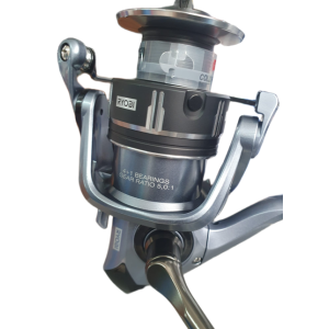 Carrete Ryobi Drex TX 5000 de perfil, con la serigrafía SUPER LIGHT / LONG CAST y el mando del freno sobre la bobina 2